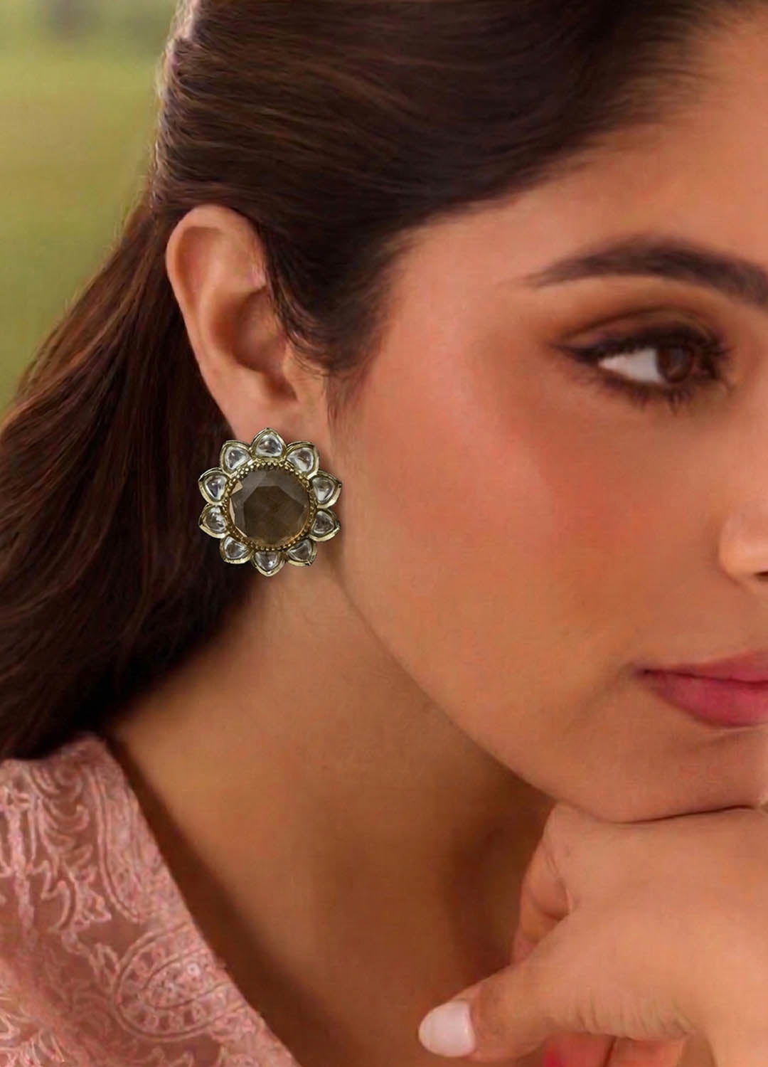 Golden polki stud earrings with traditional design