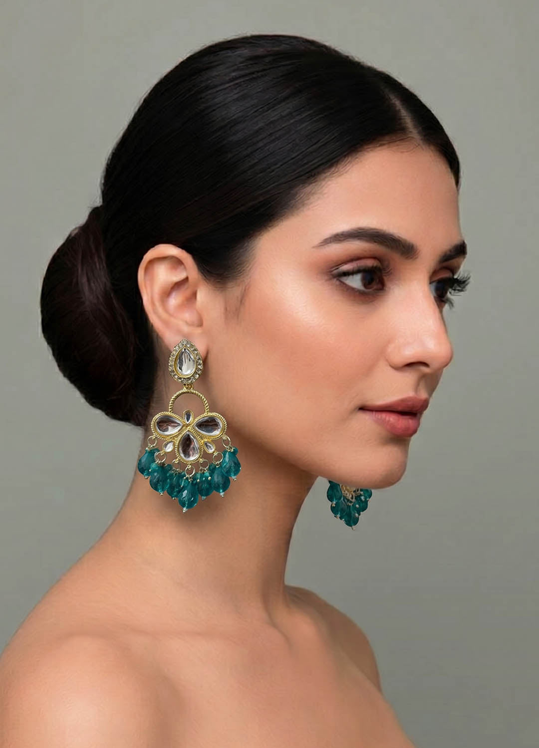 Teal blue polki earrings with intricate design