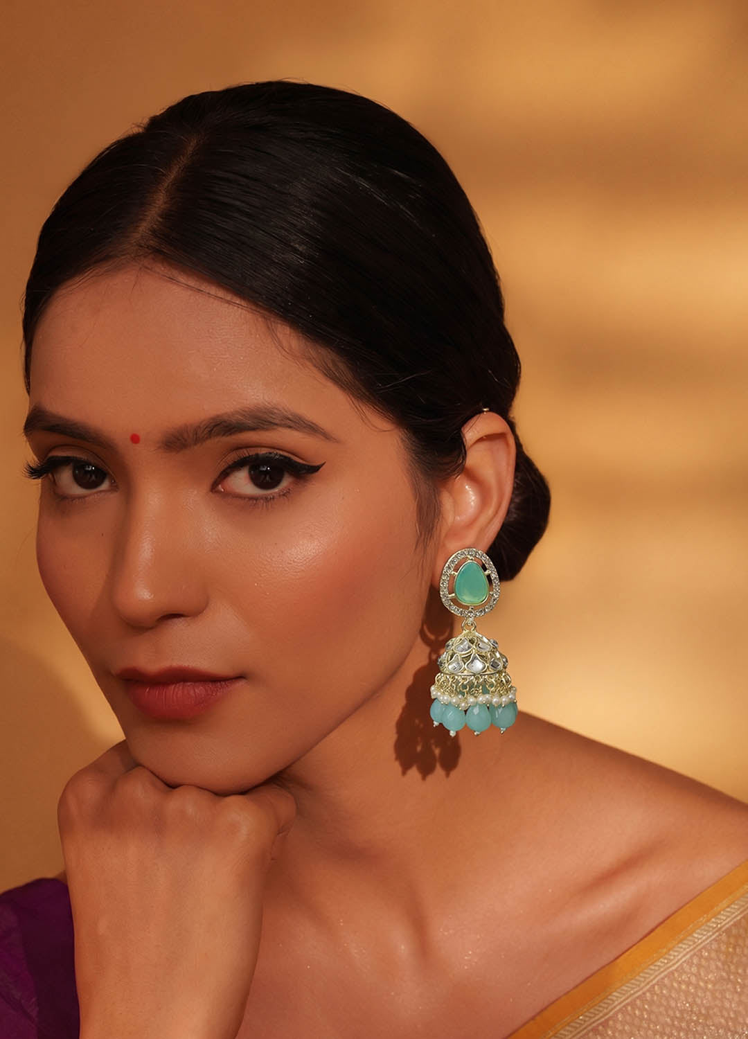 Mint green polki earrings with intricate design