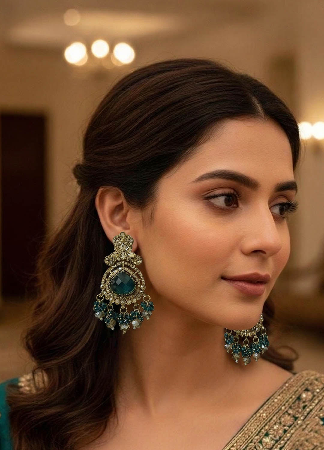 Teal blue polki earrings with intricate design